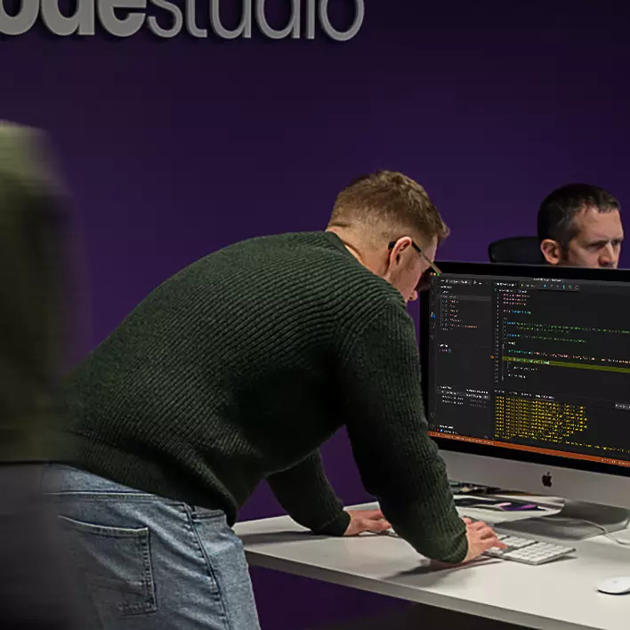 SourceCodeStudio team working in the studio