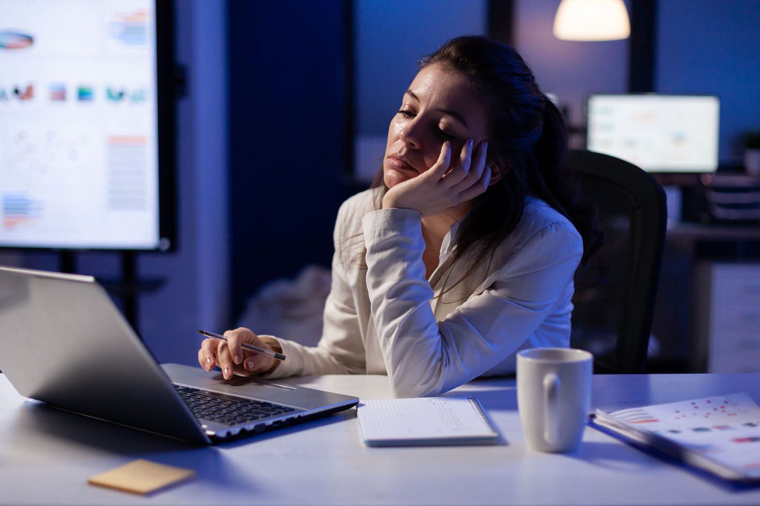 Woman sleeping at desk