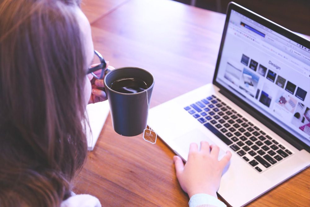 Woman on laptop researching design