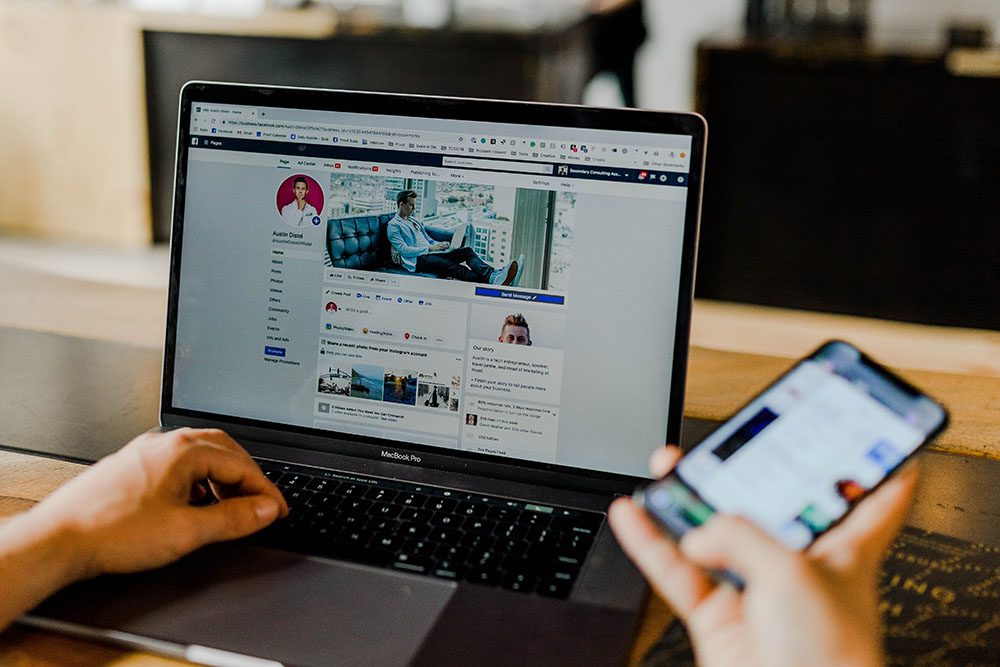 Person using LinkedIn on computer and phone