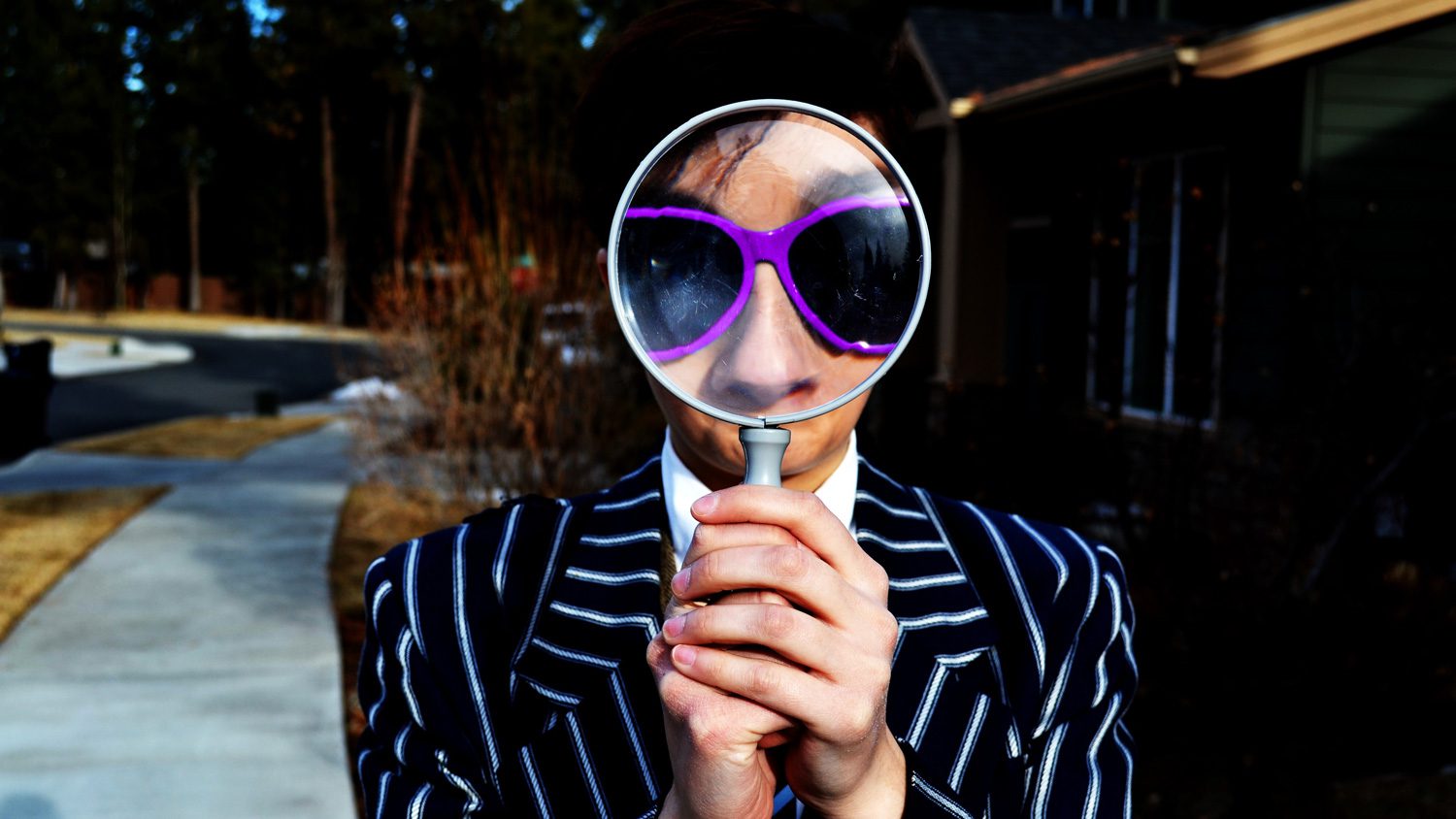 A guy with a magnifying glass trying to find SEO