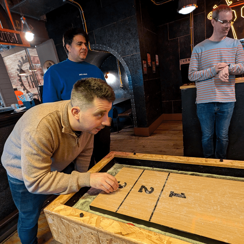 SourceCodeStudio Team member Akos playing Shuffle board