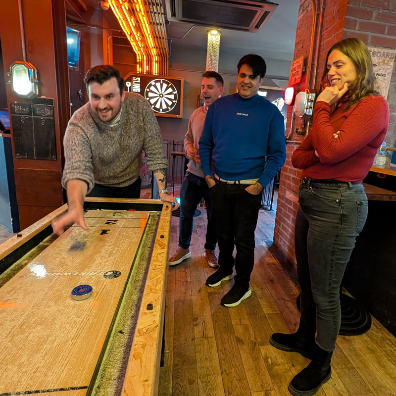 SourceCodeStudio Team member Kieran playing Shuffle board