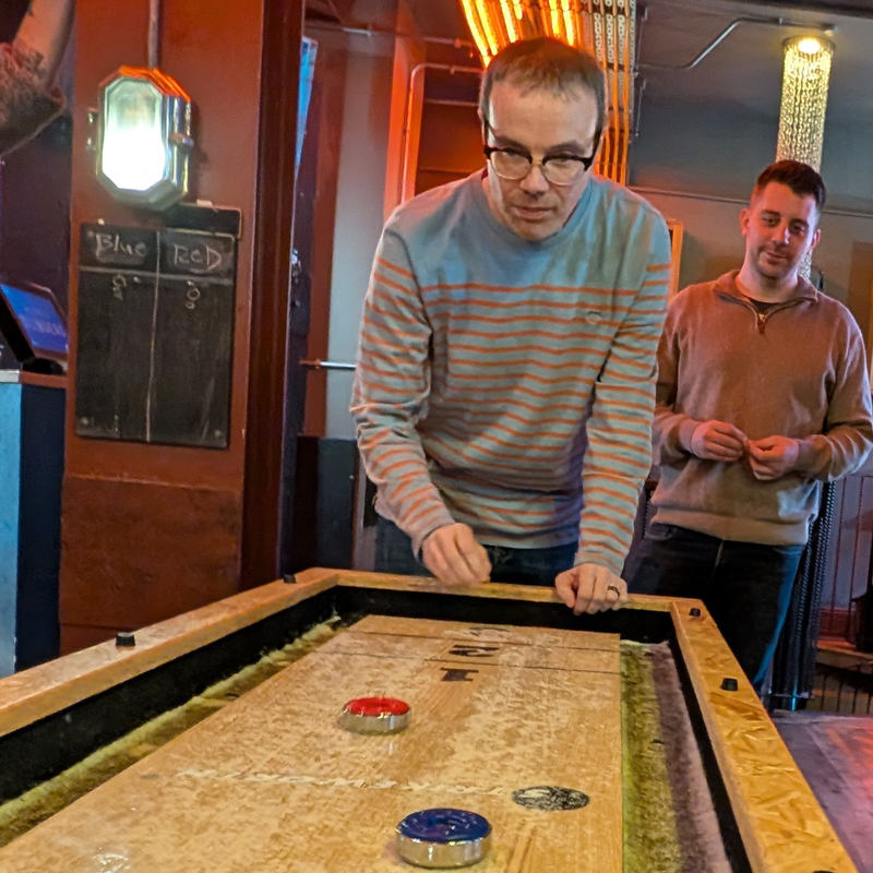 SourceCodeStudio Team member Simon playing Shuffle board