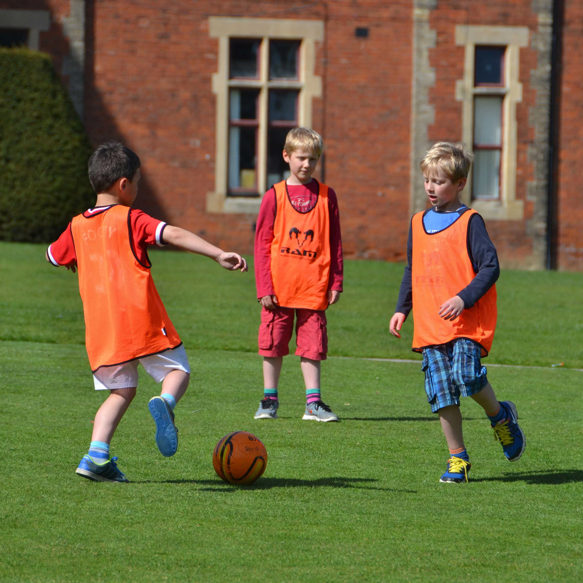 Barracudas activity day camps kids playing football